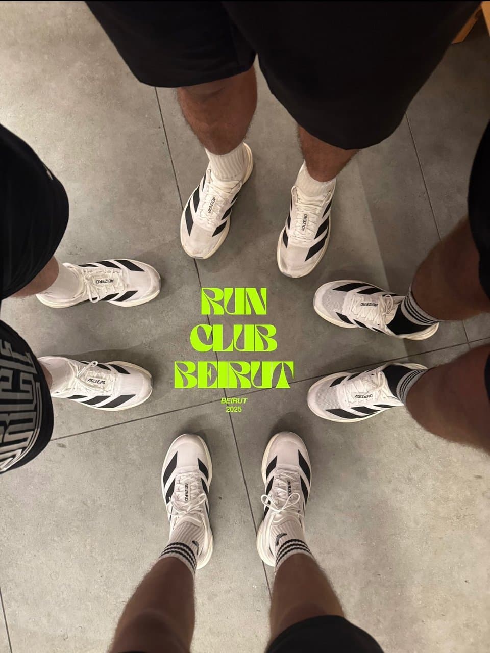 Six pairs of running shoes arranged in a circle around a 'Run Club Beirut, Beirut 2025' graphic on the ground